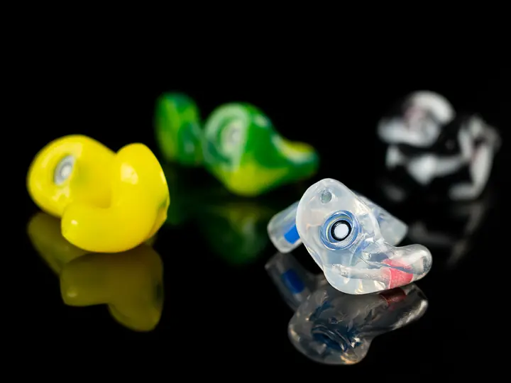 The One filtered earplugs in yellow, green swirl, black-and-white and clear