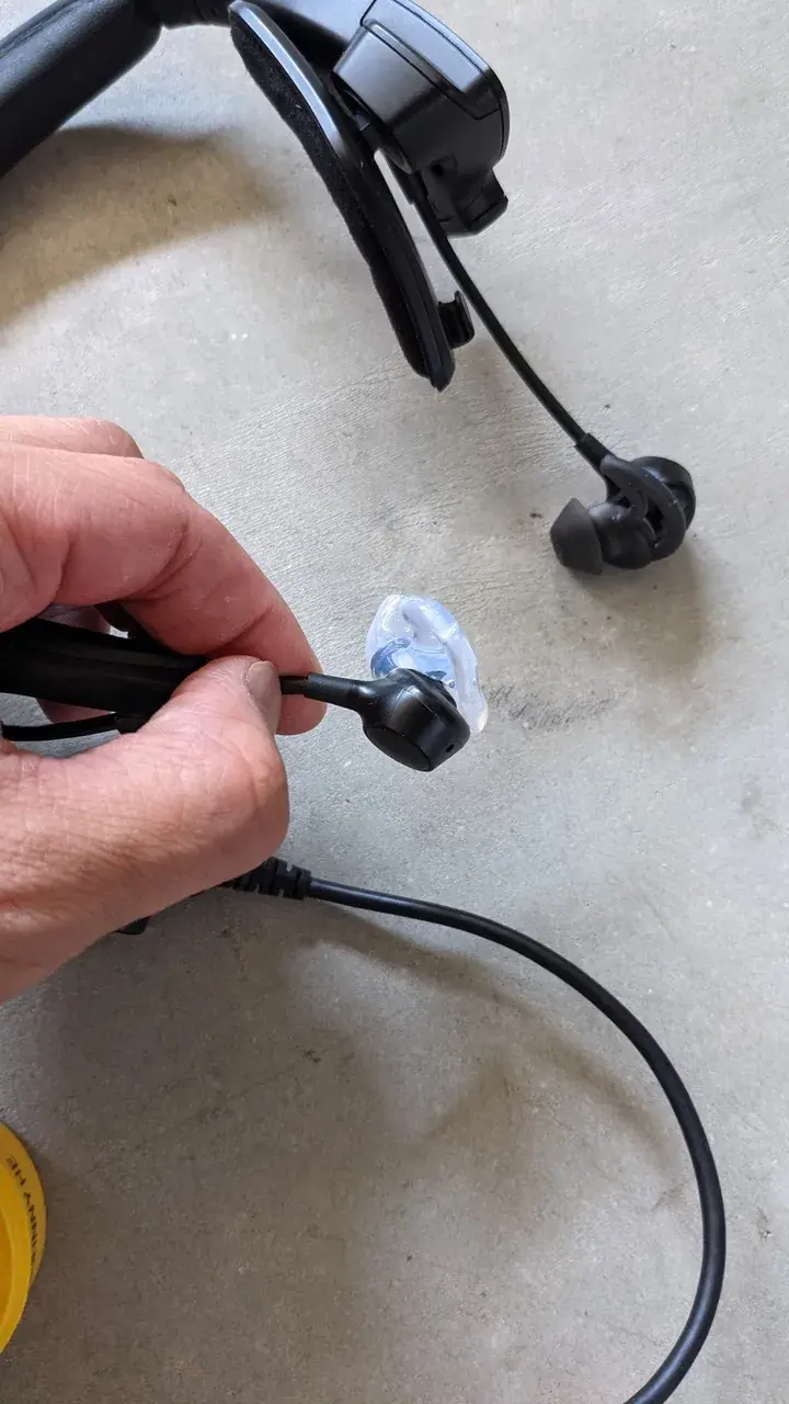 Bose ProFlight earbud seated into the custom Big Ear adapter