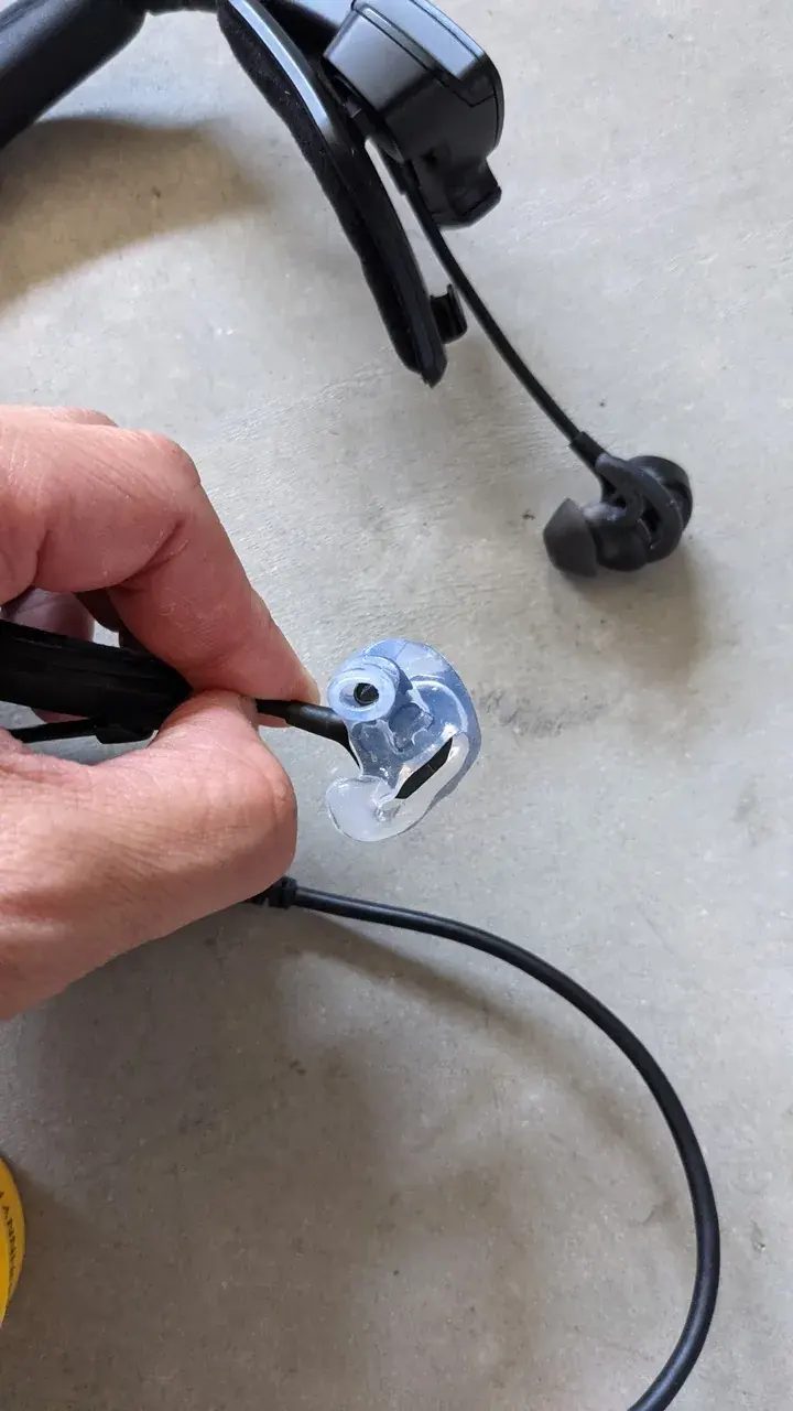 The clear custom Big Ear shell for the Bose ProFlight adapter, molded to the ear