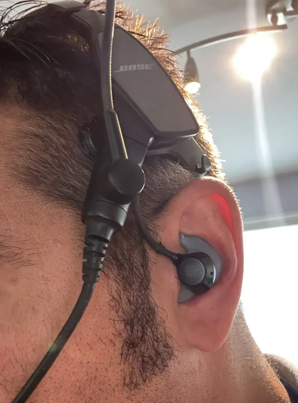 Big Ear custom Bose ProFlight adapter worn in the ear with the headset
