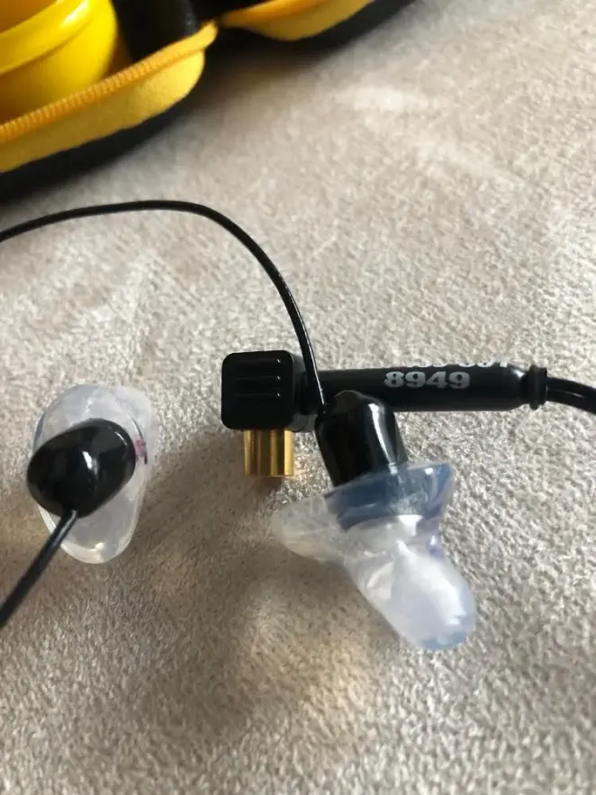 Custom CEP adapters on the earpieces beside the case