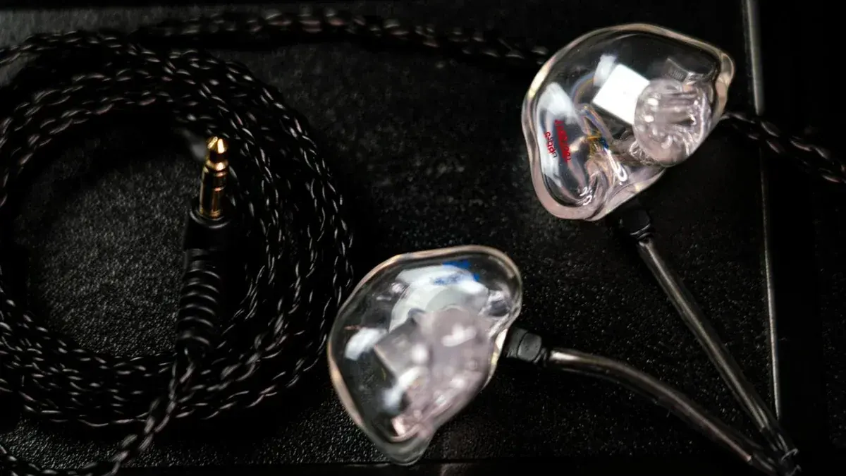 Close-up of the multi-driver internals of a Big Ear custom in-ear monitor, hand-built in the USA
