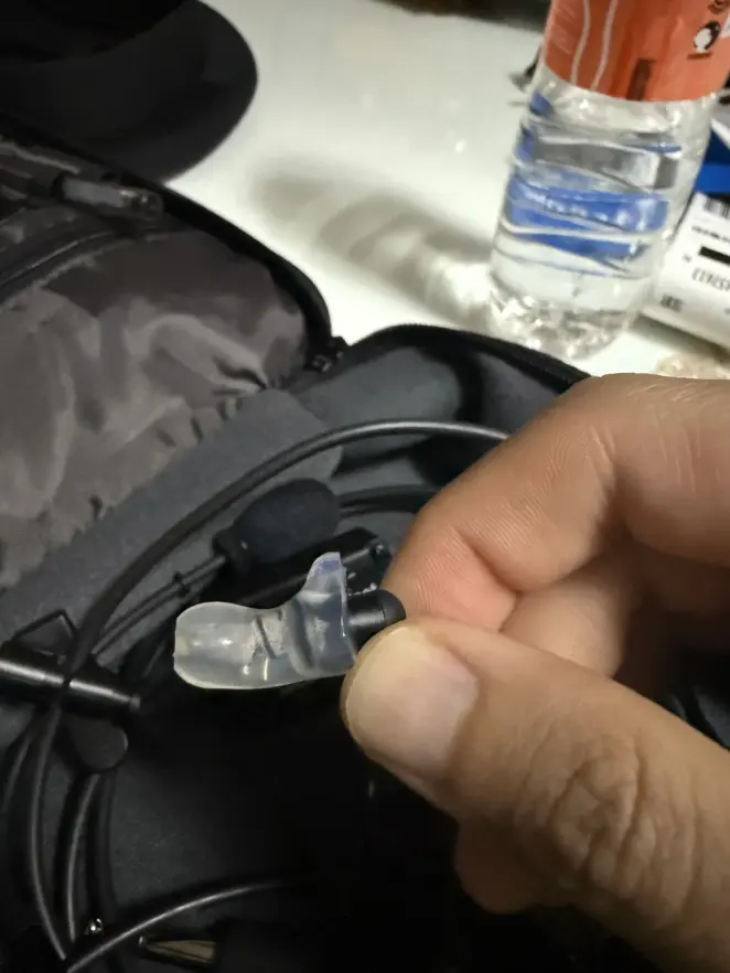 A clear custom Clarity Aloft adapter held in hand