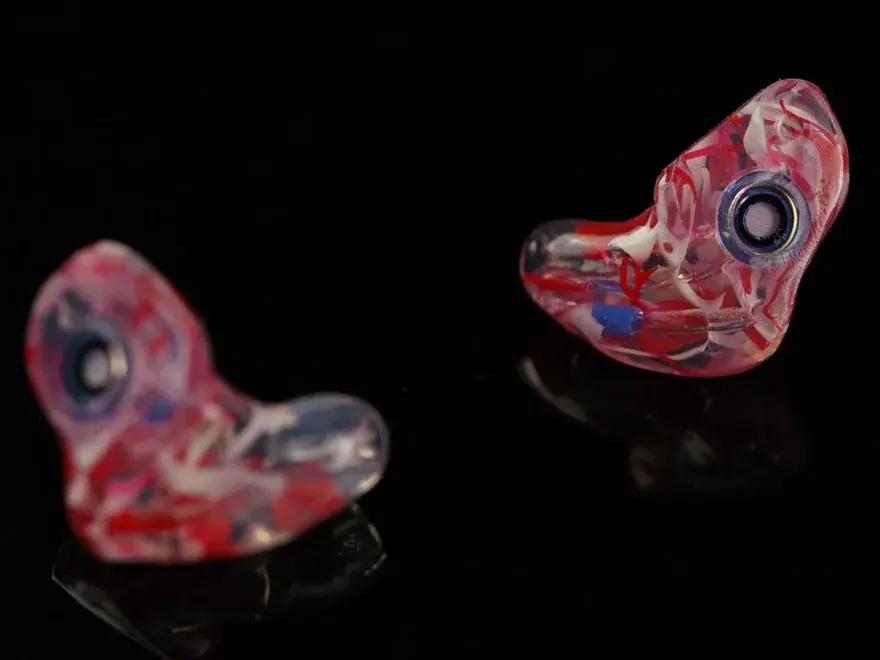 Macro detail of a hand-built Big Ear custom filtered earplug