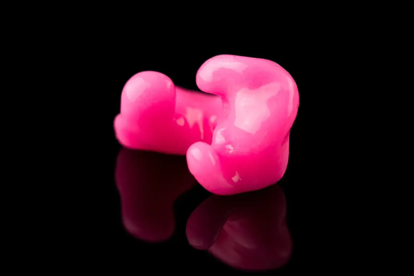 Pink custom-molded sleeping earplugs by Big Ear