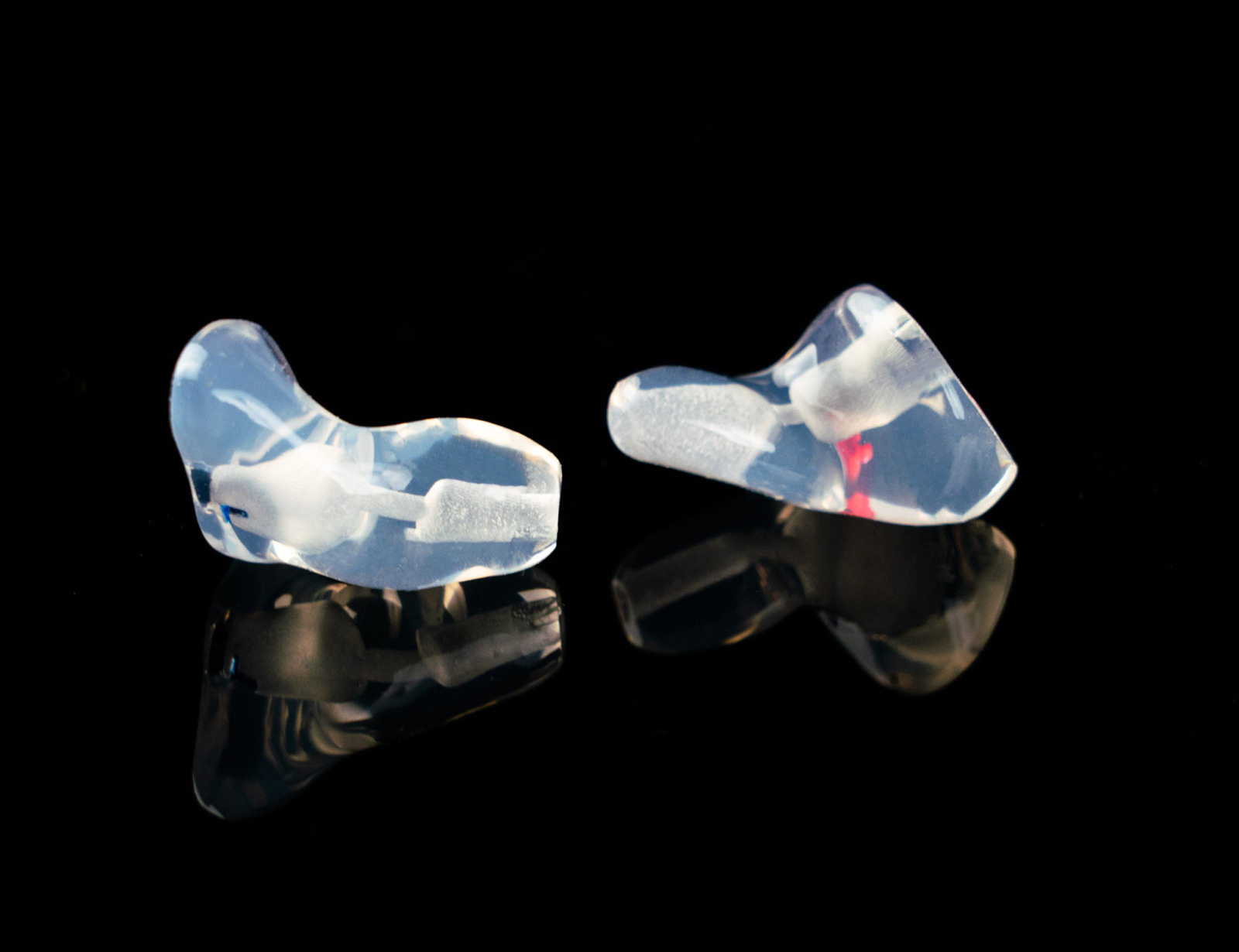 Pair of clear custom molded Clarity Aloft aviation headset adapters